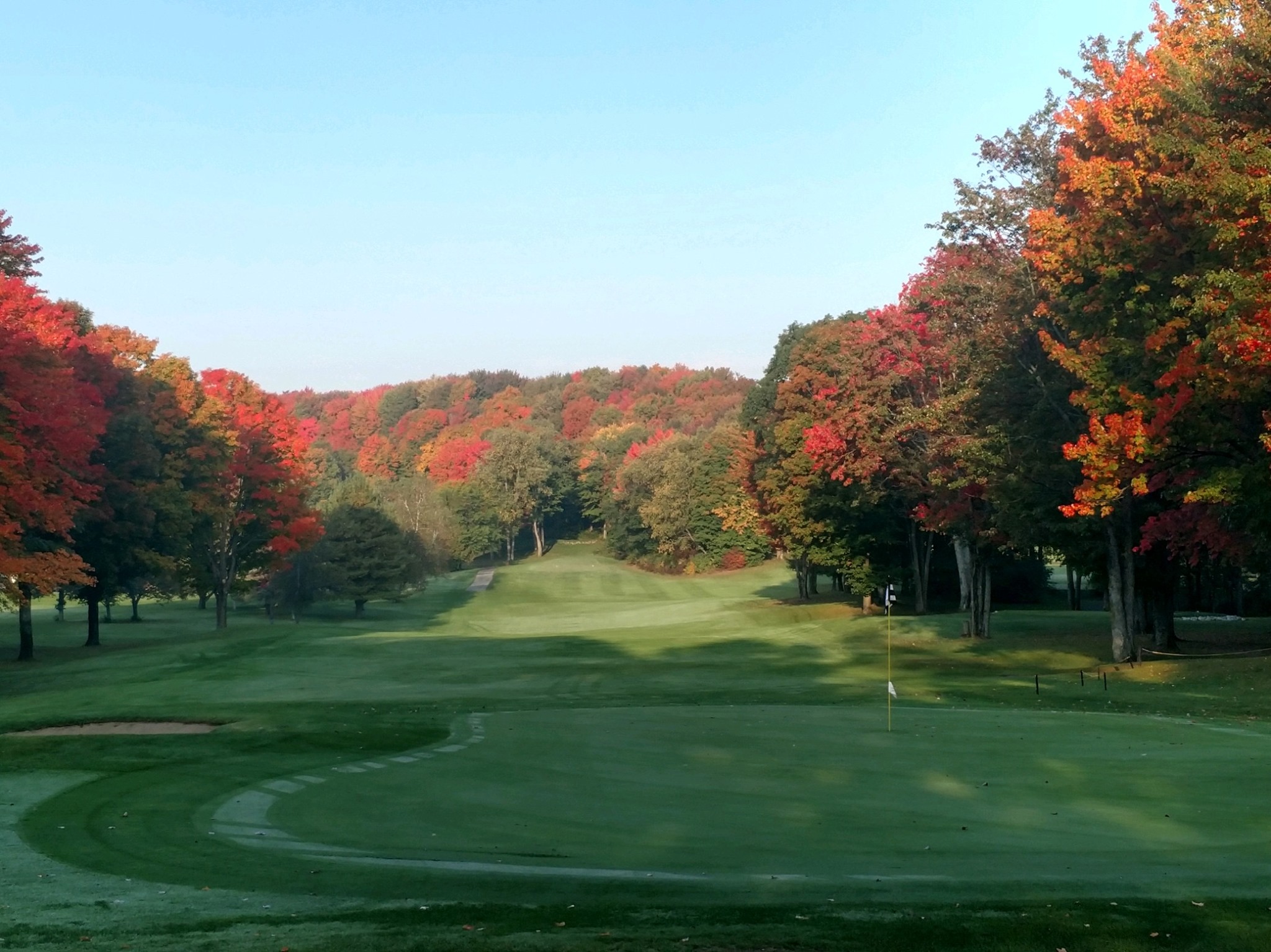 golf course fairway with autumn trees